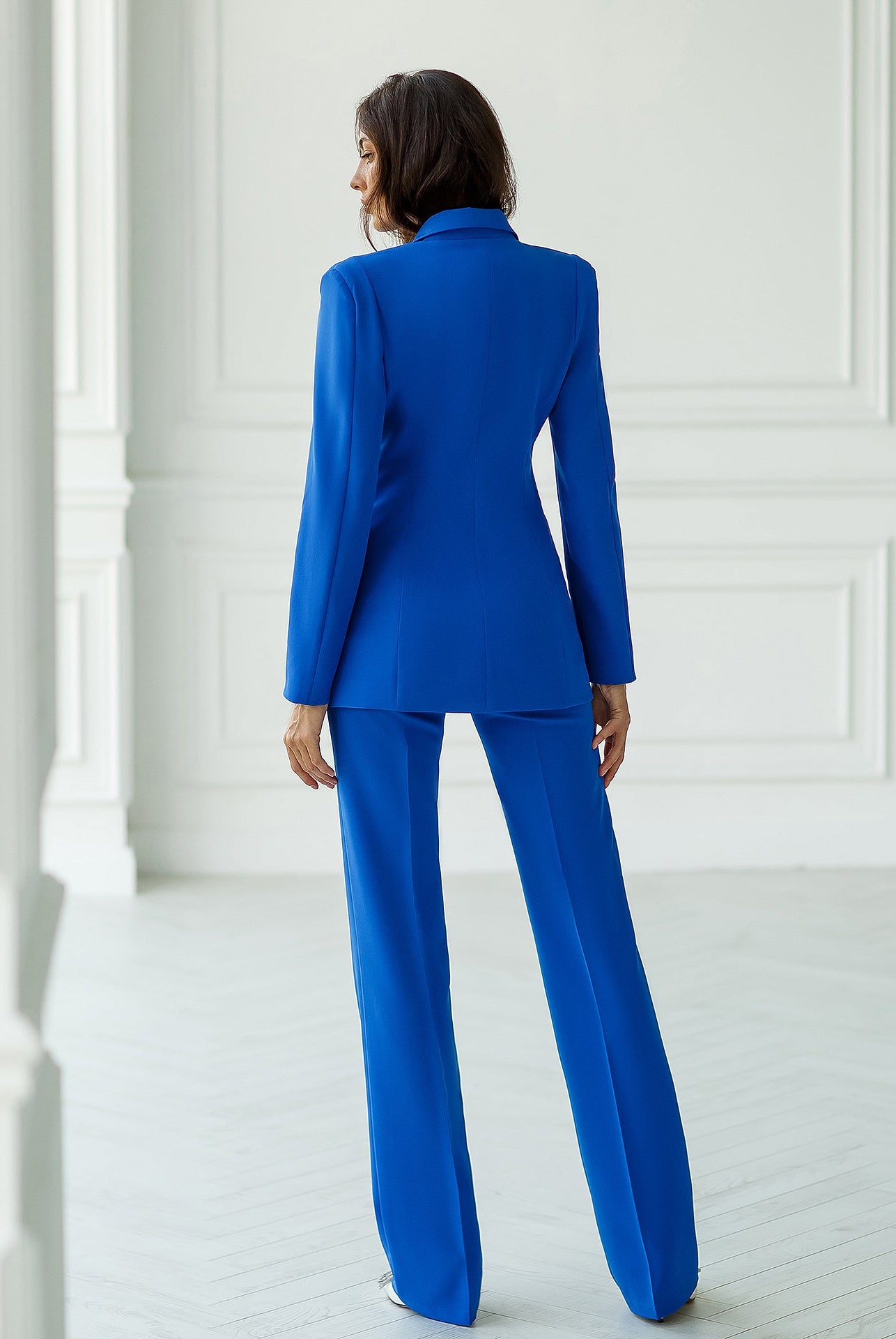 Blue double-breasted blazer suit set with straight fit trousers.