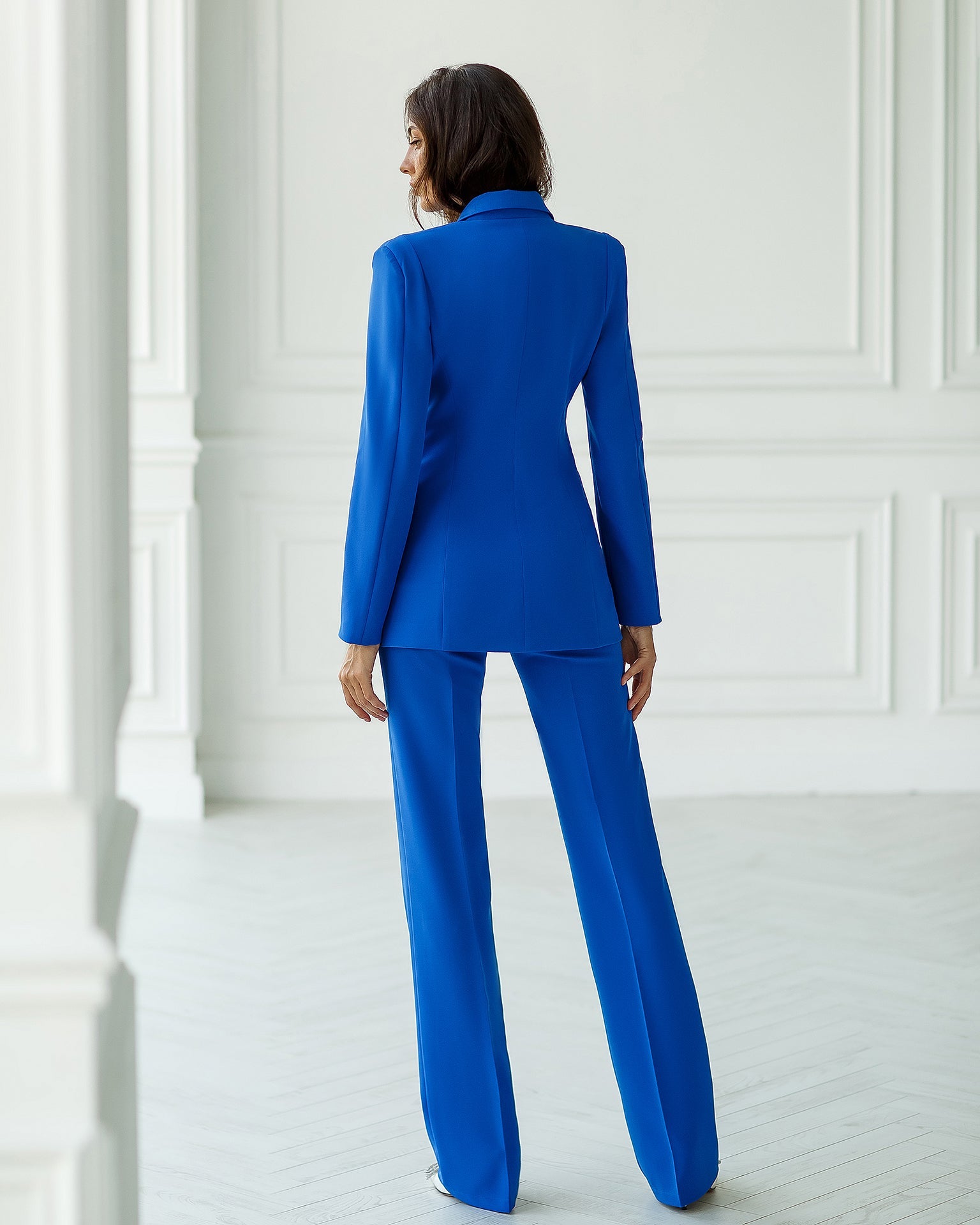Blue double-breasted blazer suit set with straight fit trousers.