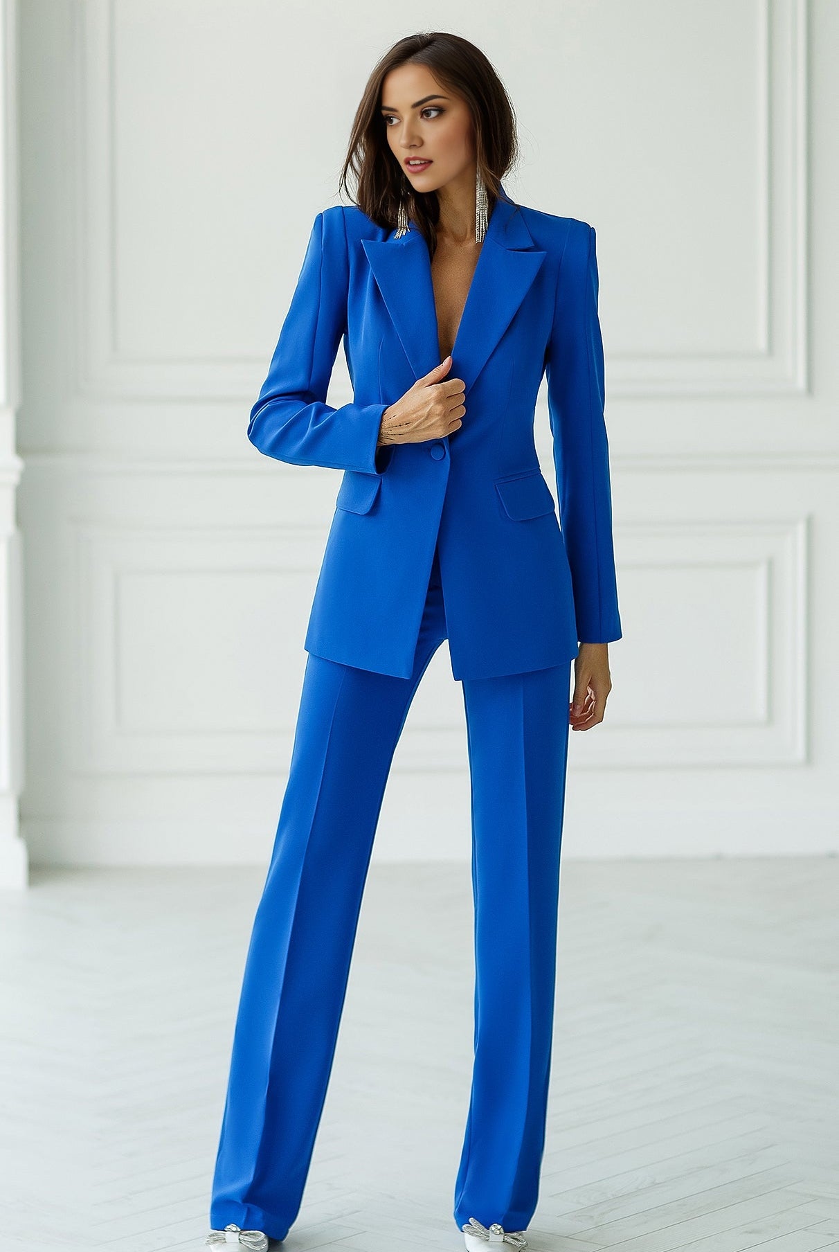 Blue double-breasted blazer suit set with straight fit trousers.
