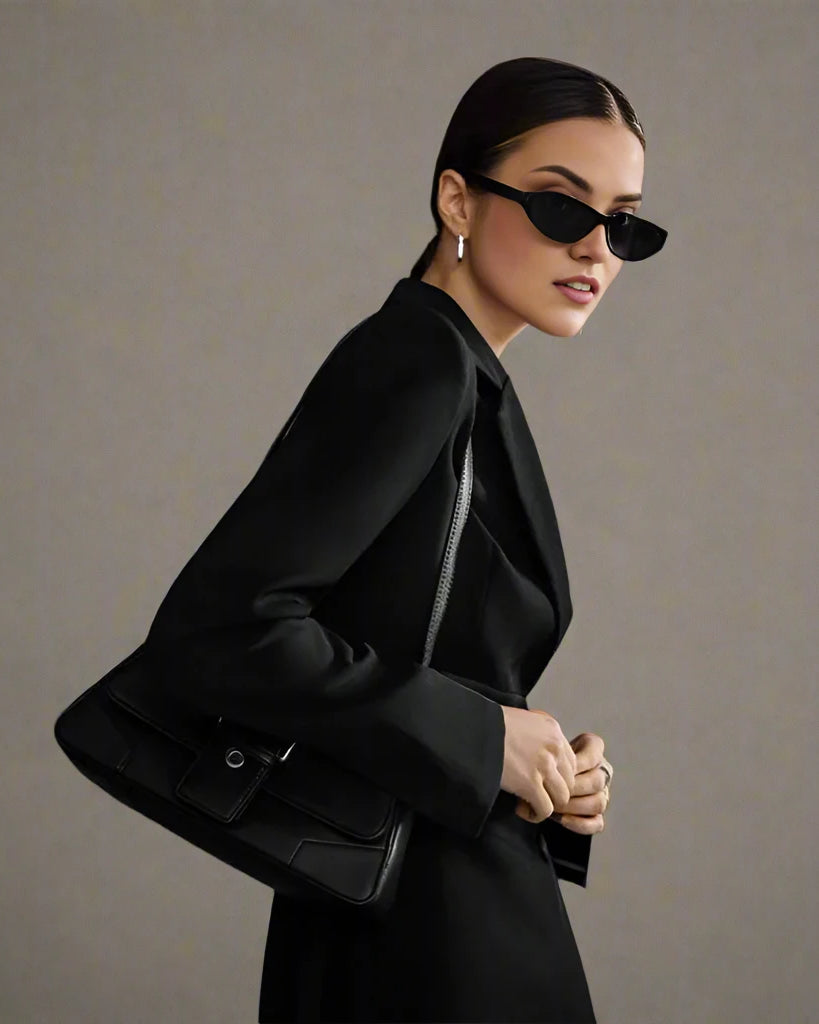 Women's black double-breasted blazer dress with buttons for evening wear.