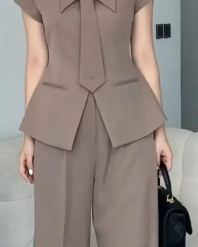 Brown coord set with a single-breasted blazer and flared pants with tie.