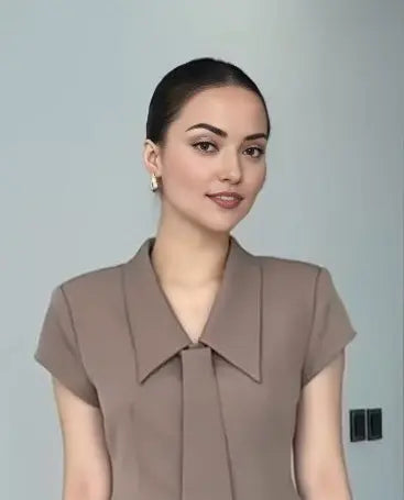 Brown coord set with a single-breasted blazer and flared pants with tie.