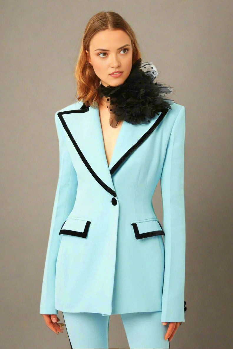 Powder blue double-breasted blazer suit set with flared trousers.