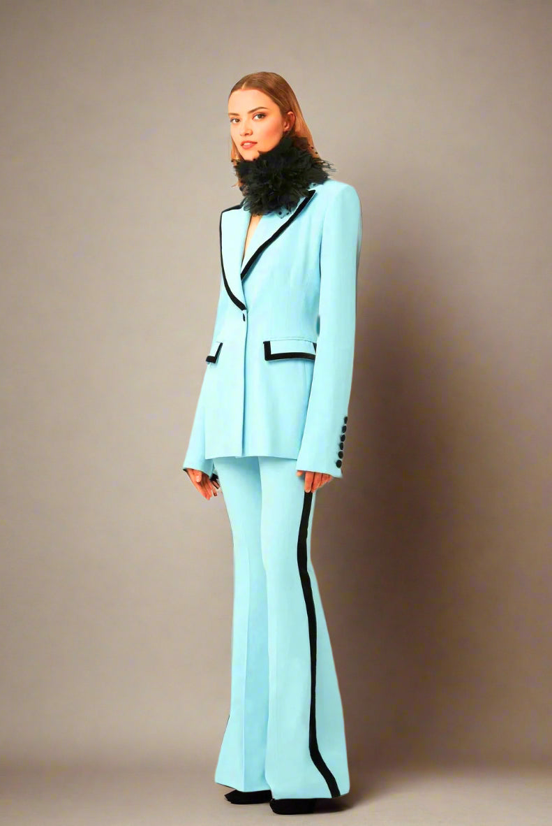Powder blue double-breasted blazer suit set with flared trousers.