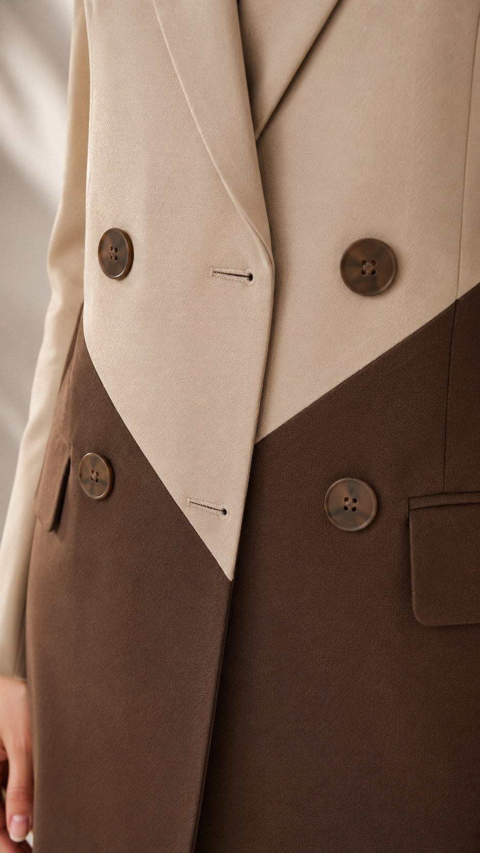 Close-up of beige and brown colourblock blazer buttons, flap pocket and cotton blend fabric | Beyond Formals
