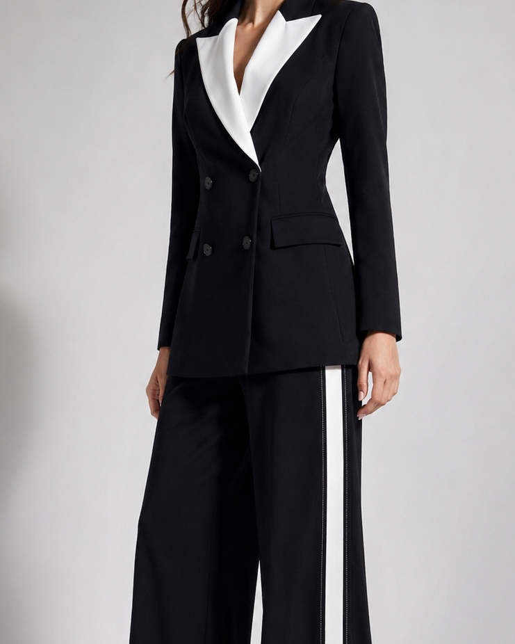 Black and white suit with wide-leg pants on a plain background