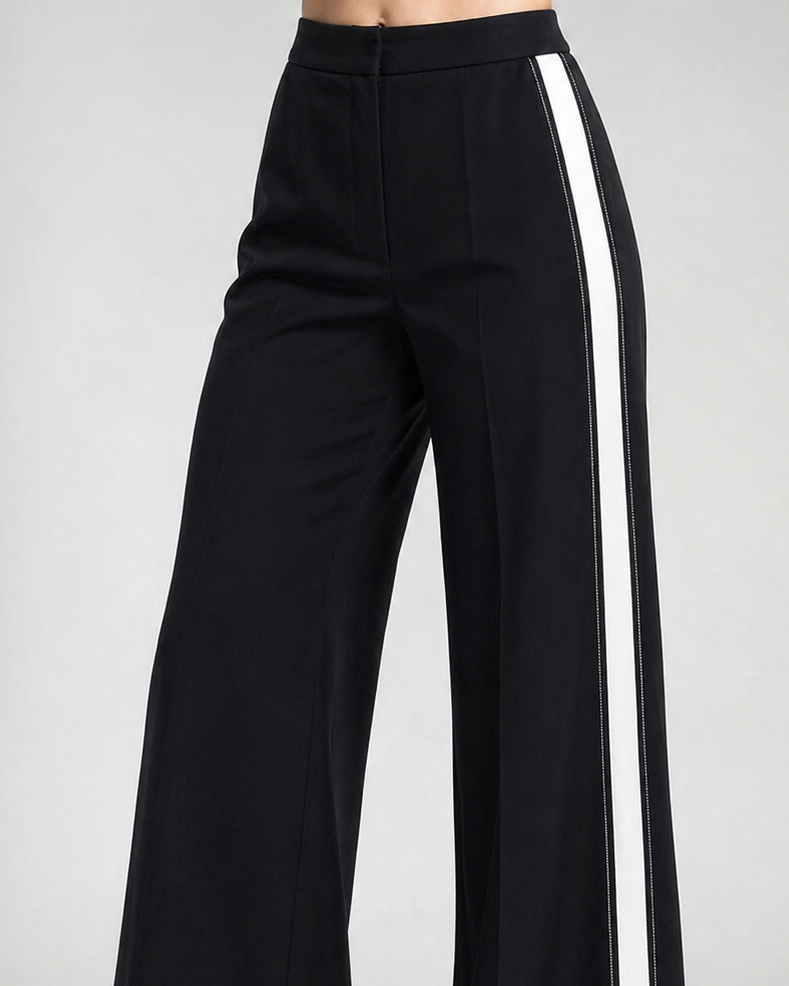 Black wide-leg pants with a white stripe on a gray background