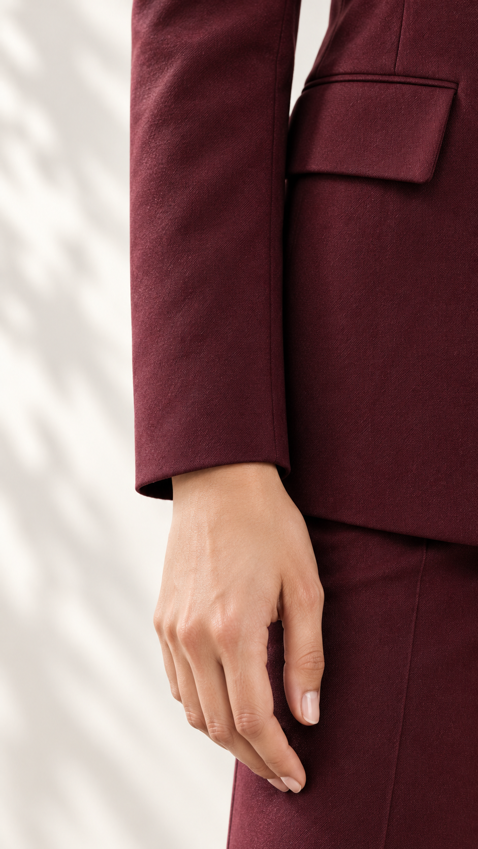 Maroon blazer close-up of clean sleeve finish and flap pocket | Beyond Formals