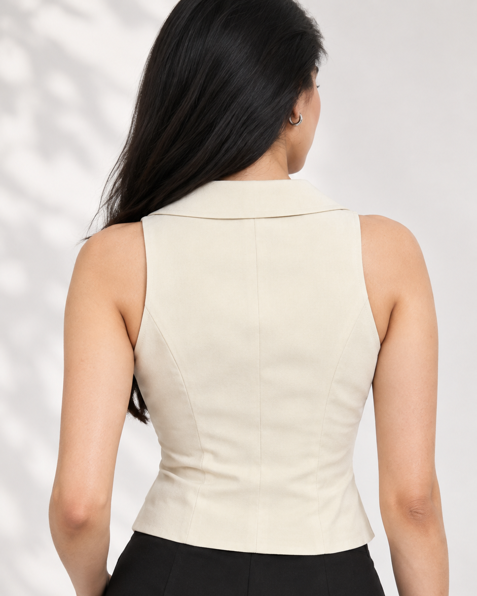 Back view of beige sleeveless tailored waistcoat with black straight-leg trousers | Beyond Formals
