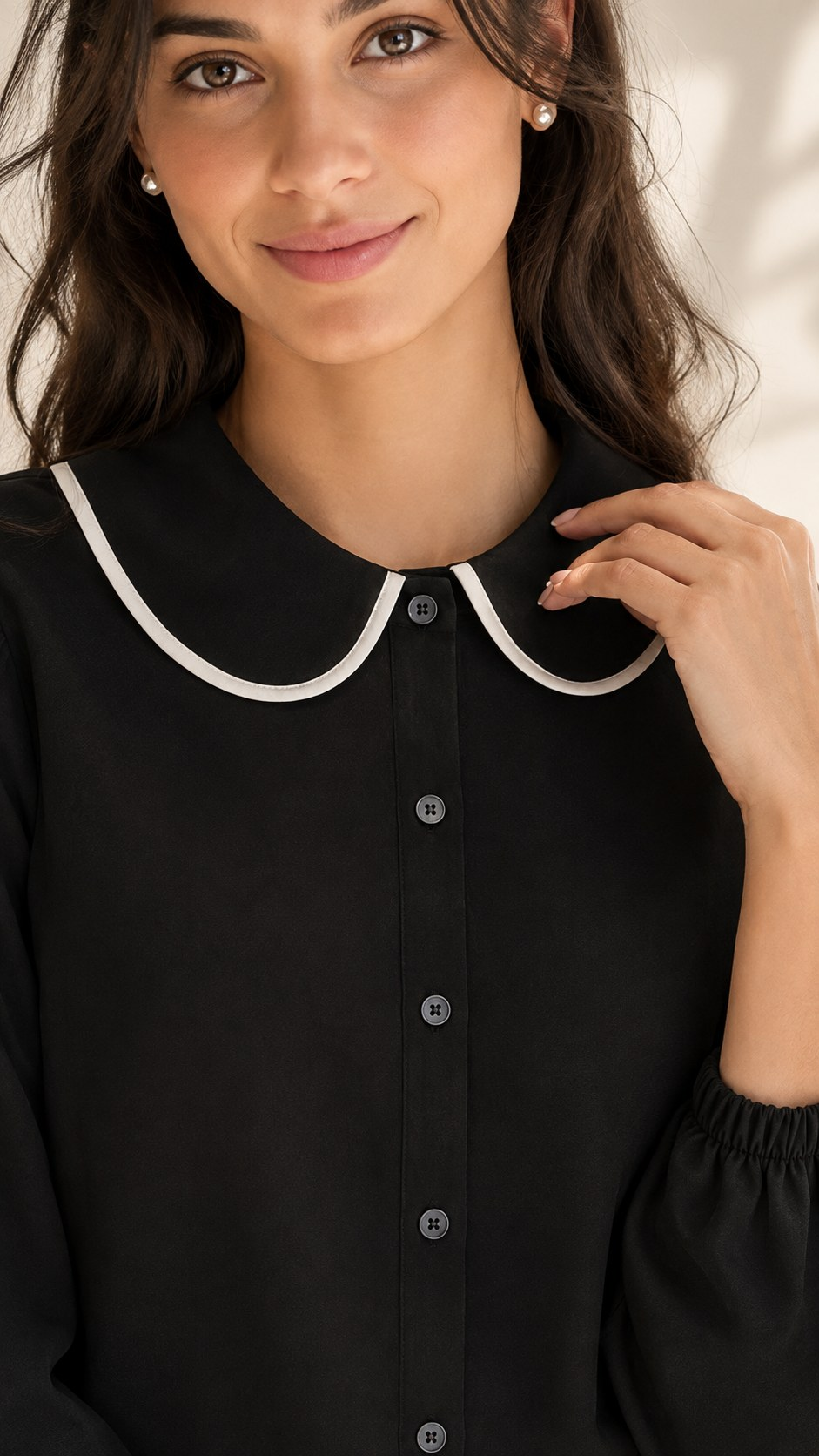 Black shirt close-up of white-piped rounded collar, button placket and elasticated cuff | Beyond Formals