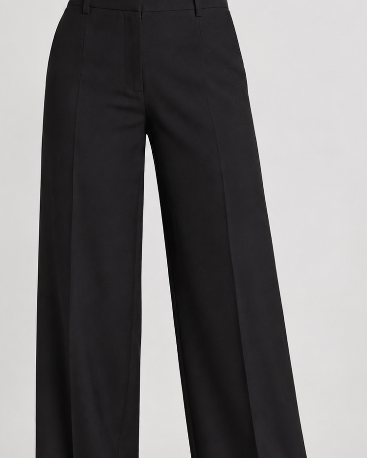 Black wide-leg trousers styled with the white bow sash blazer, lower-body view | Beyond Formals