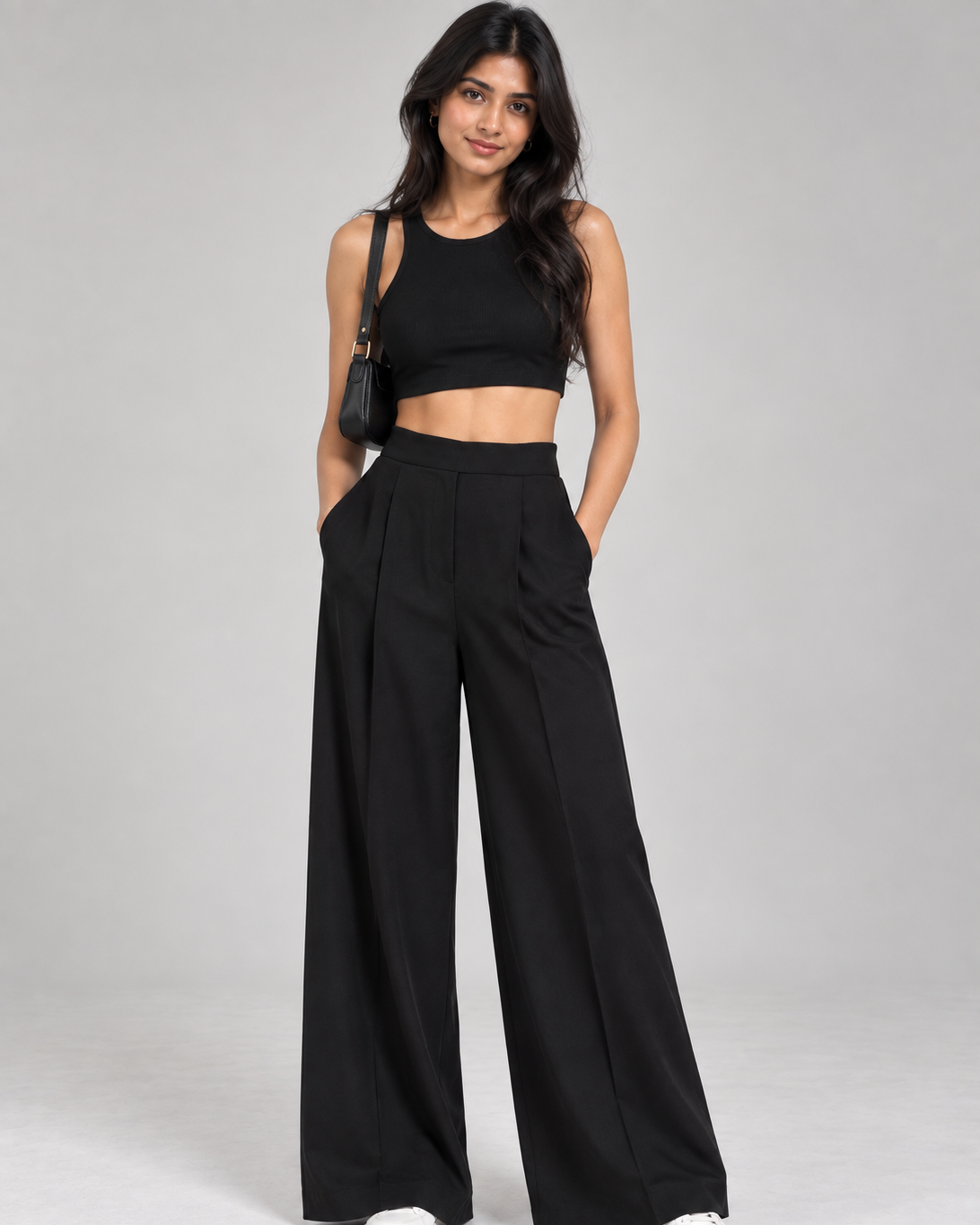 Black wide-leg pleated formal trousers with black crop top on model, full-length front view | Beyond Formals