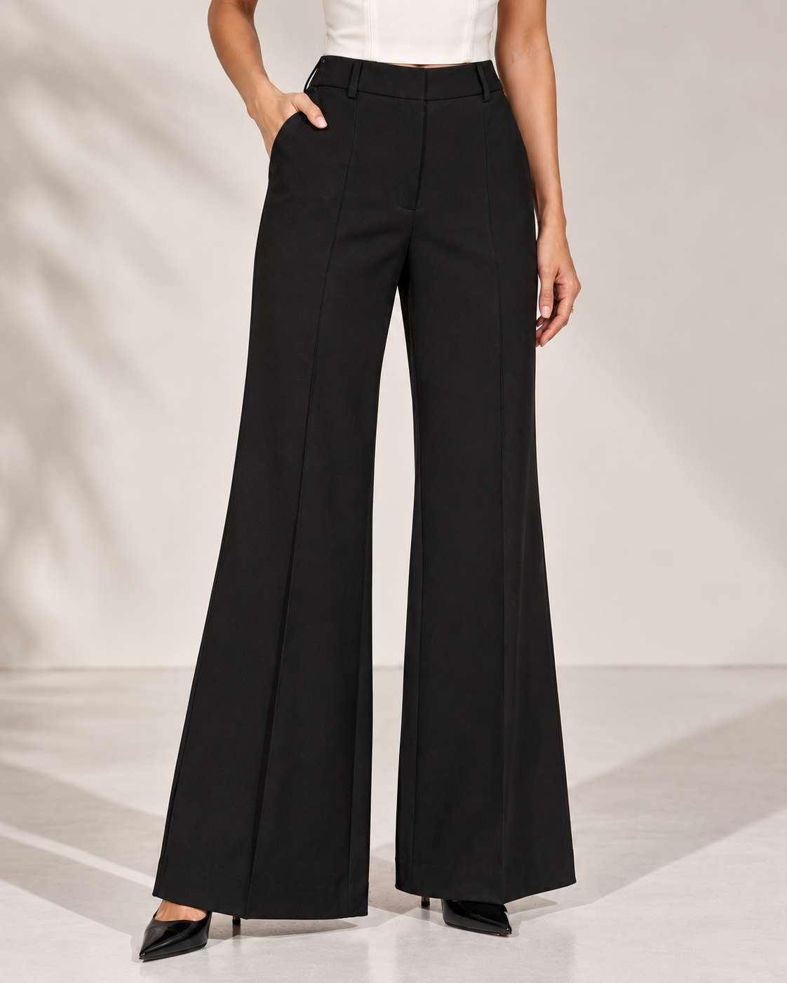 Black high-rise flared trousers, front view showing waistband, side pockets and crease | Beyond Formals