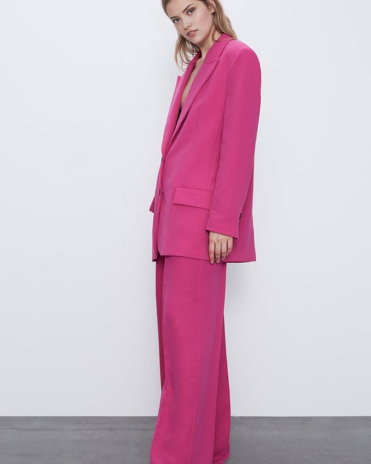 Pink oversized blazer suit set with high-waisted wide leg trousers.