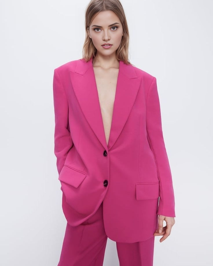 Pink oversized blazer suit set with high-waisted wide leg trousers.