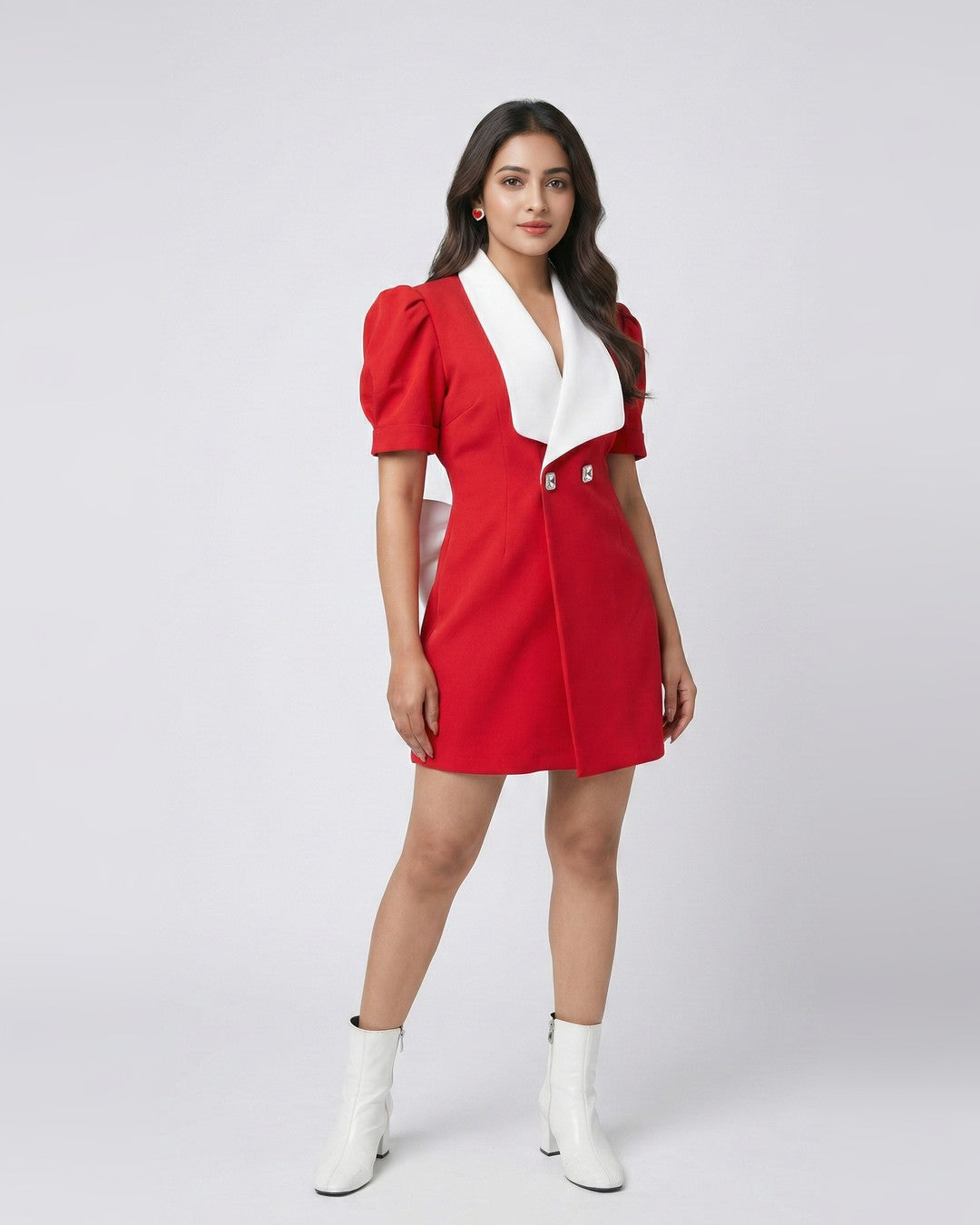Red bow-tie blazer dress with white contrast lapel, full-length front view with white boots | Beyond Formals