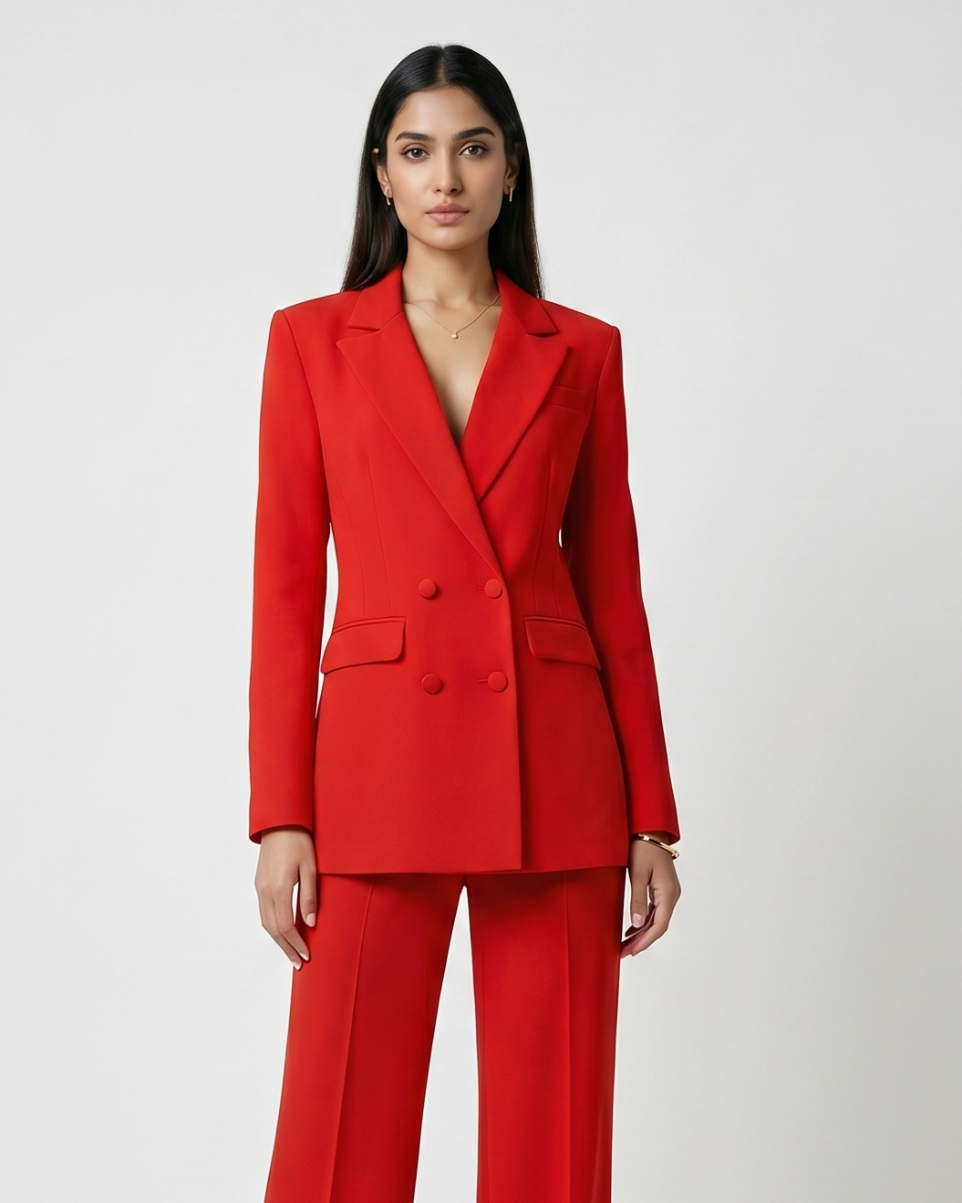 Woman wearing a red suit on a white background