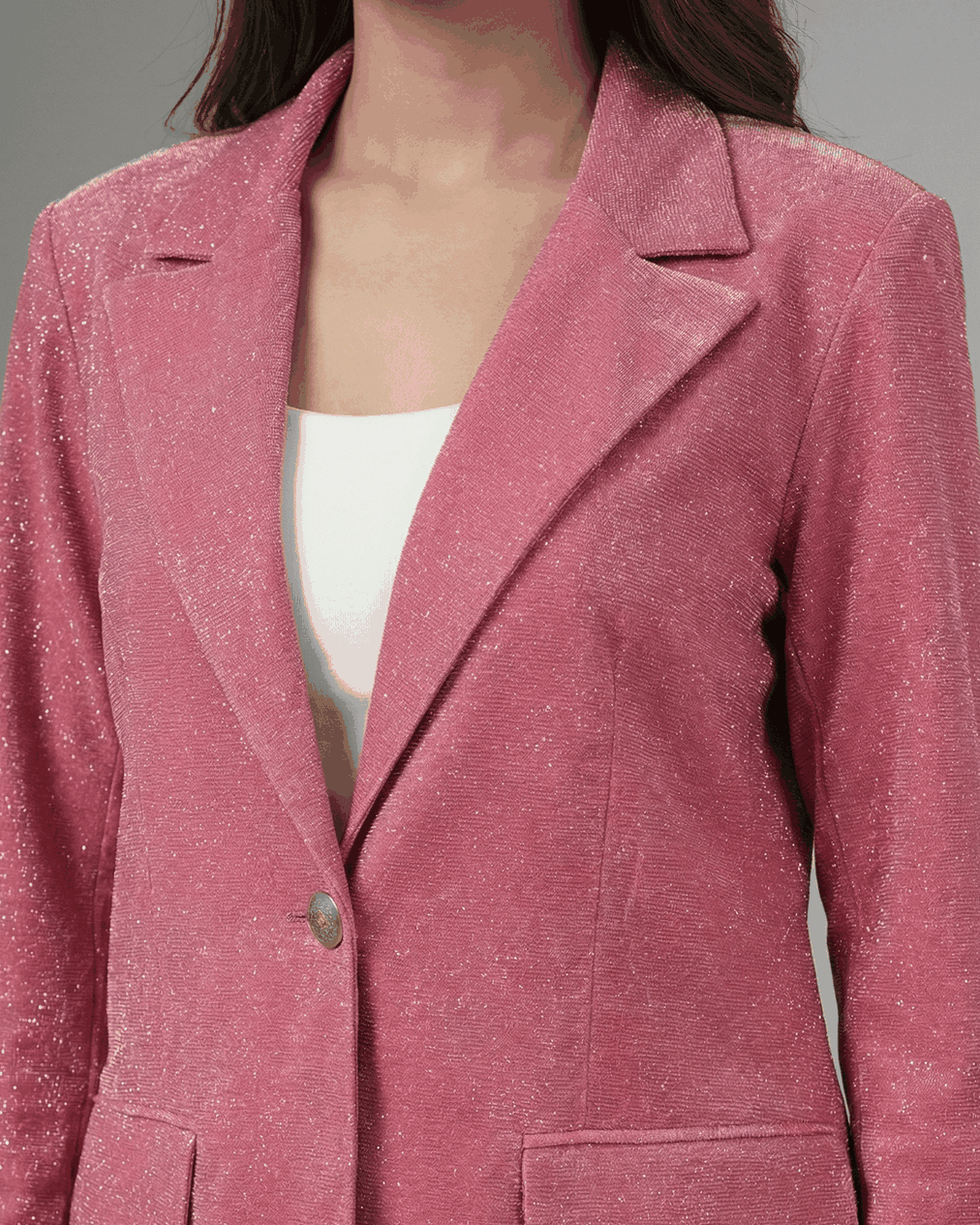 Pink shimmer blazer, close-up of notched lapel, single button and flap pockets | Beyond Formals