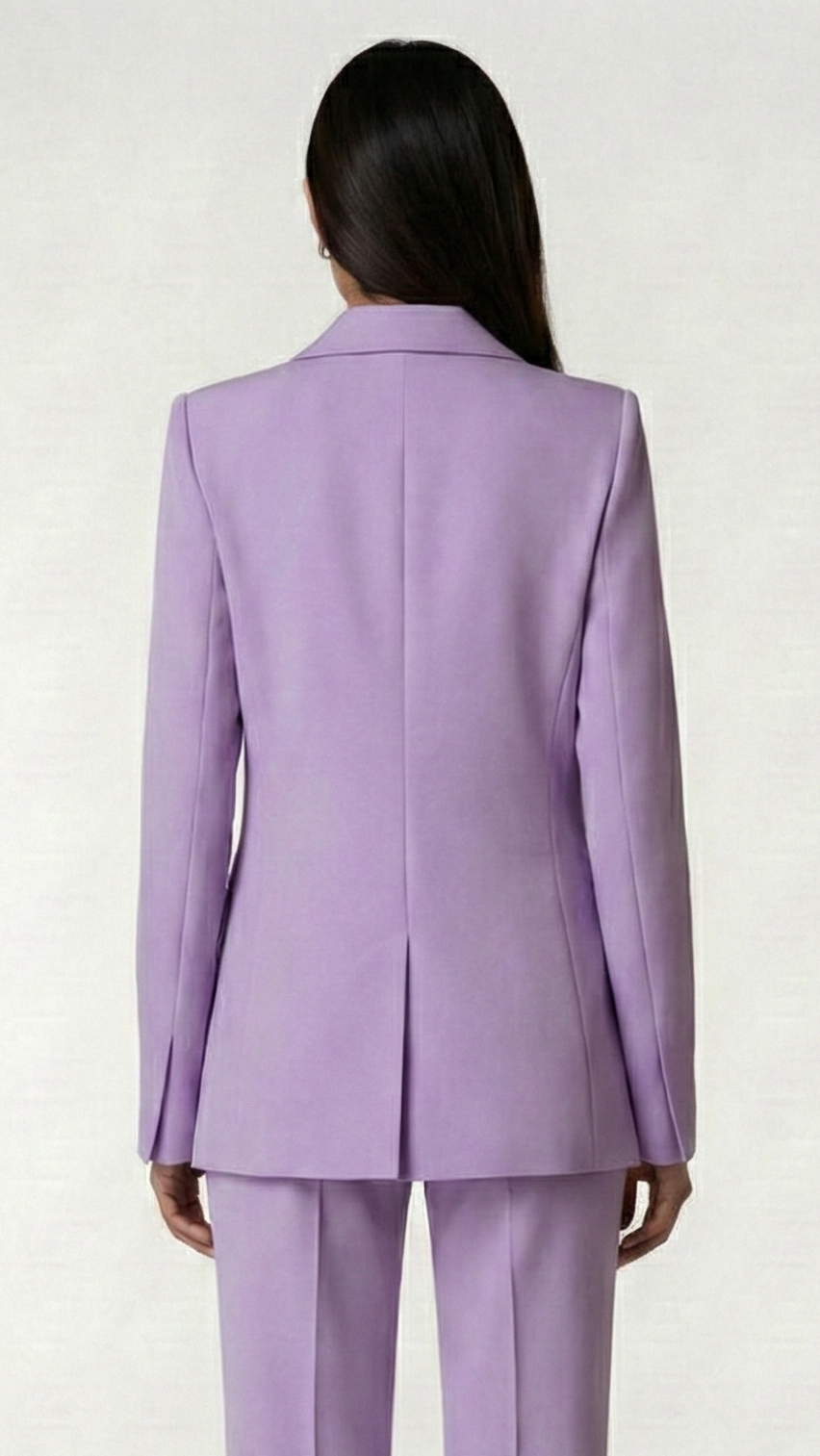 Person wearing a lavender suit on a white background