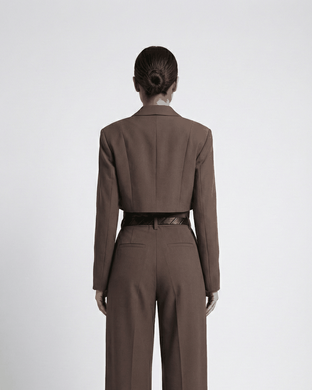 Brown cropped blazer suit set on model, back view showing back welt pockets and wide leg | Beyond Formals