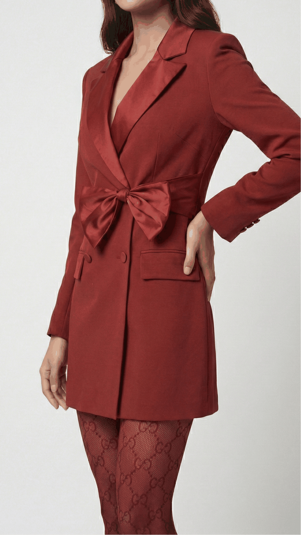 Maroon double-breasted blazer dress satin waist bow and flap pocket, close-up | Beyond Formals