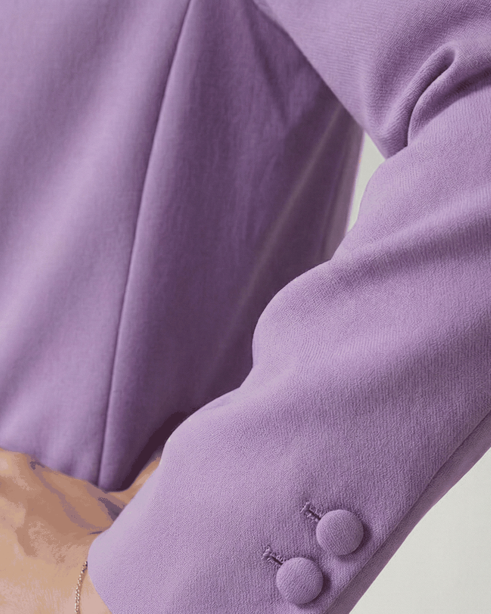 Lavender blazer sleeve, close-up of self-covered cuff buttons | Beyond Formals