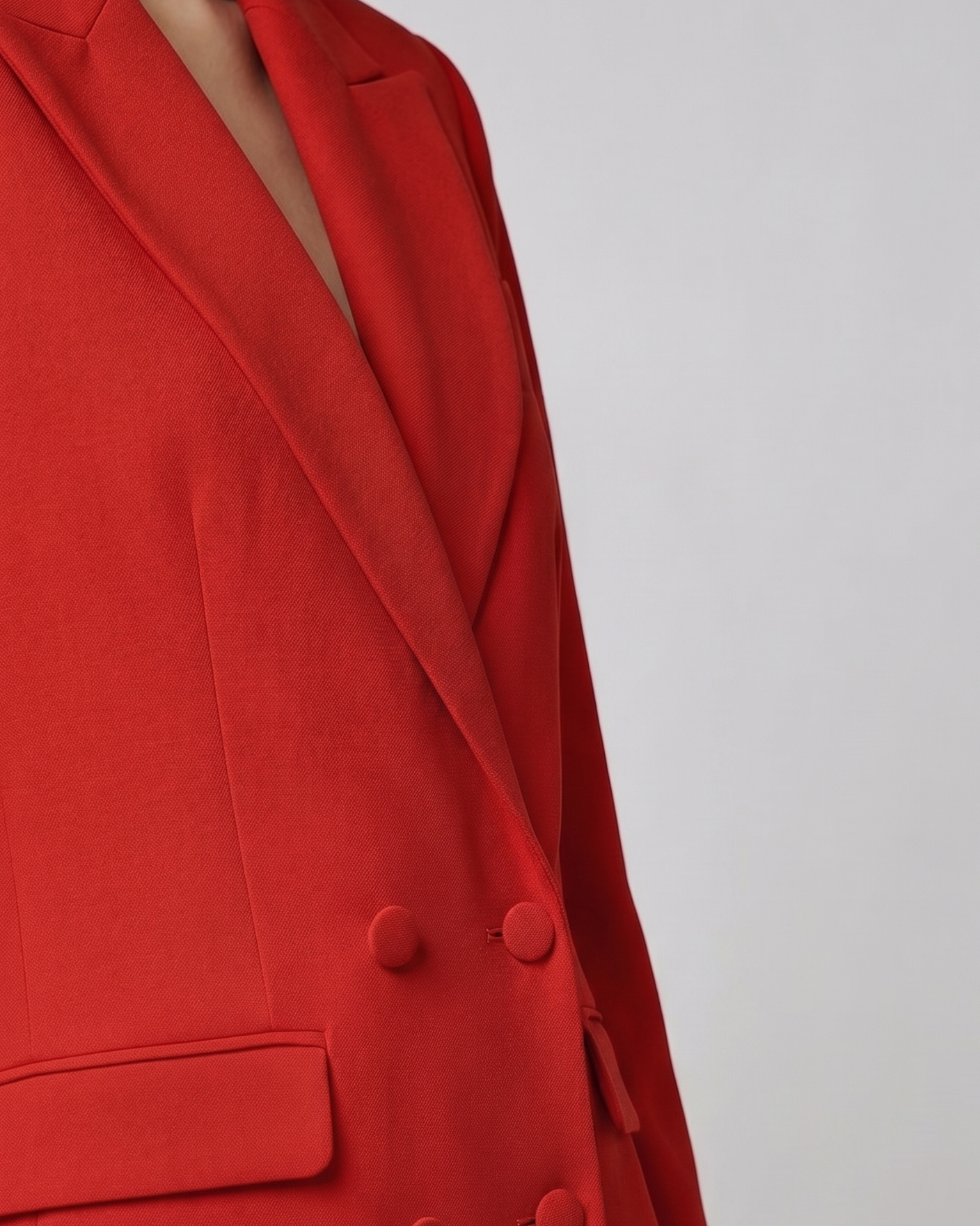 Red blazer with a plain background