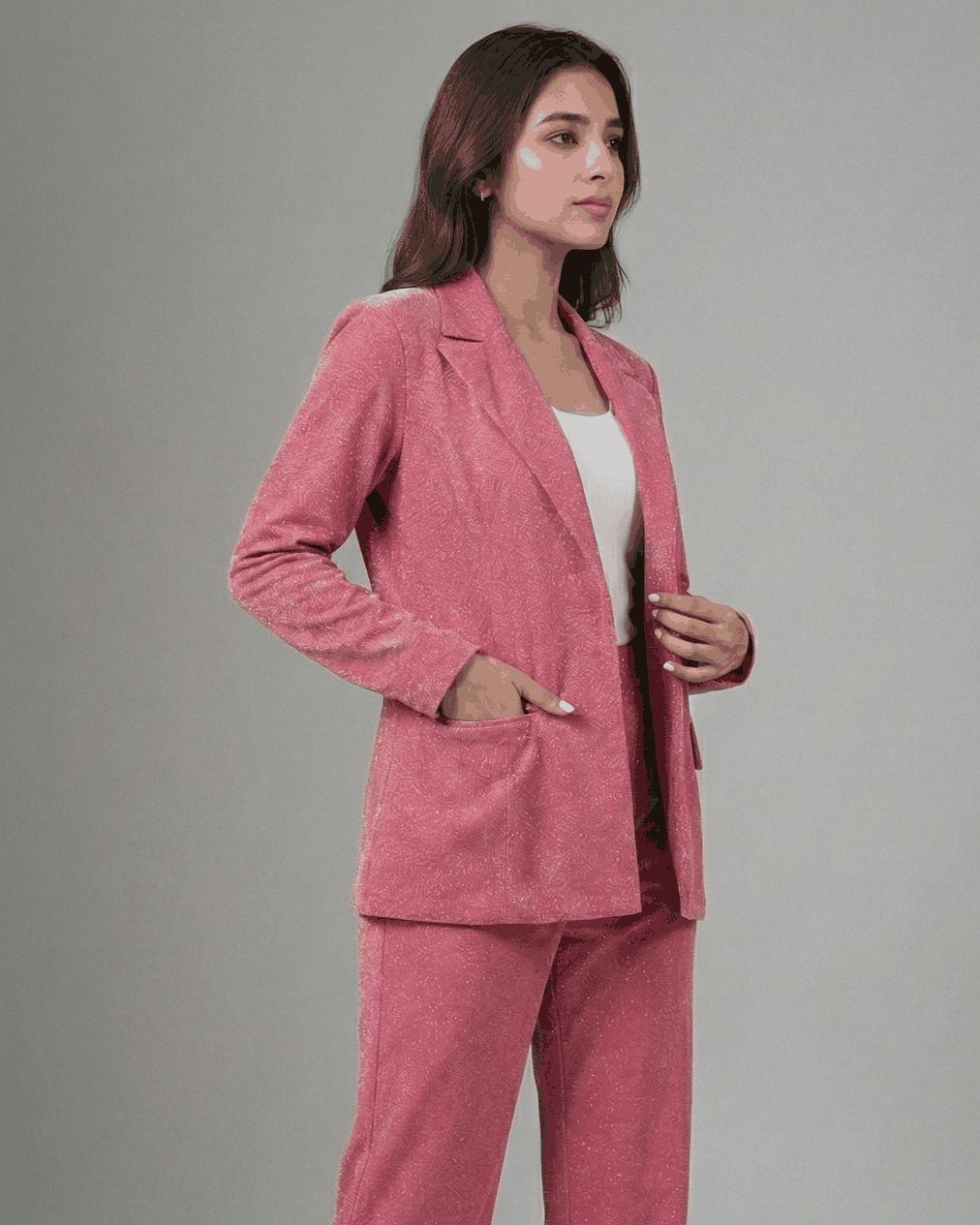 Pink brocade suit set, side angle with hand in blazer pocket | Beyond Formals