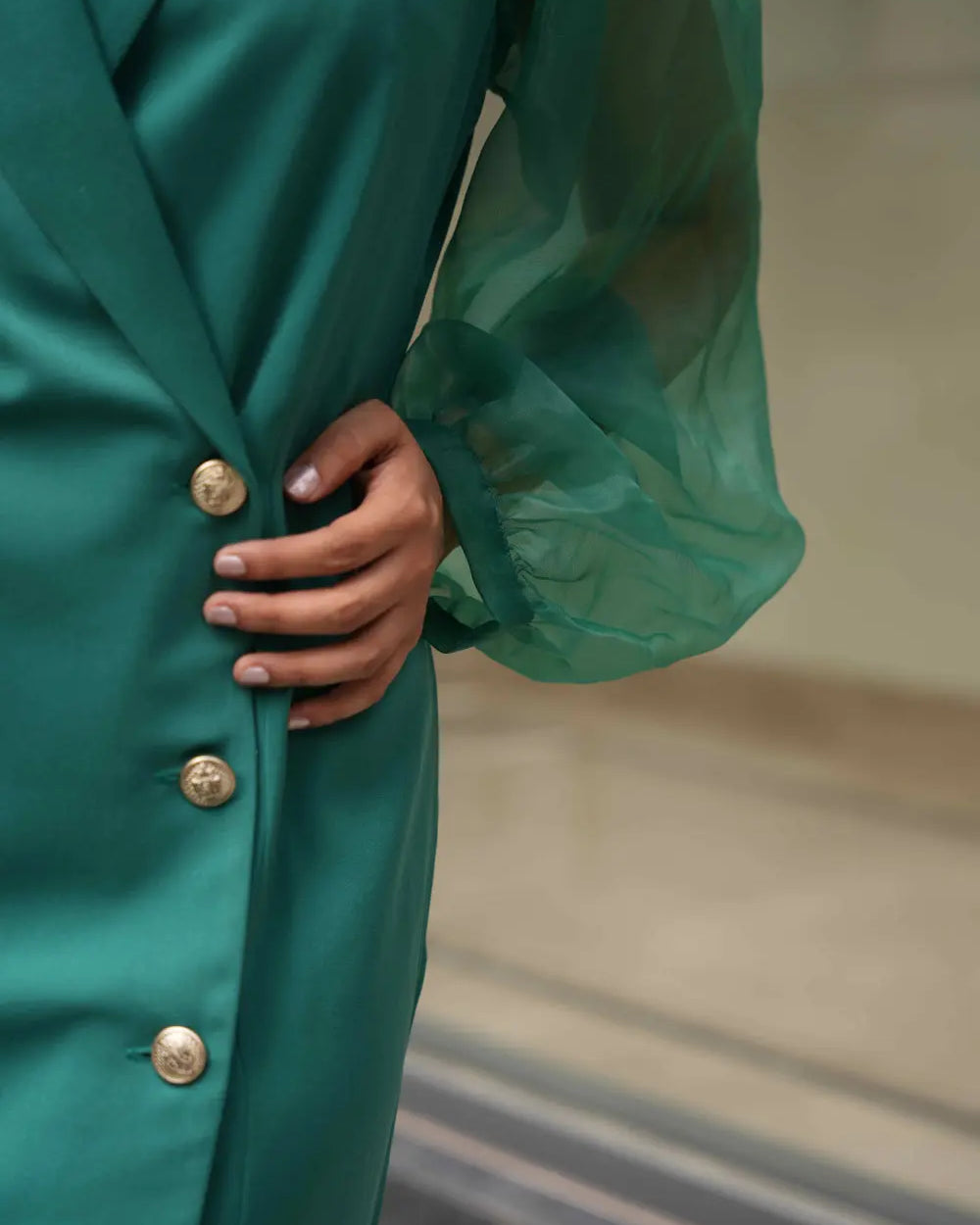 Women's green single-breasted blazer dress for minimalist styling.