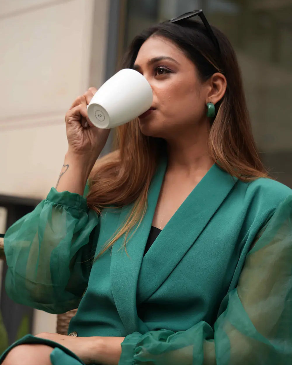 Women's green single-breasted blazer dress for minimalist styling.