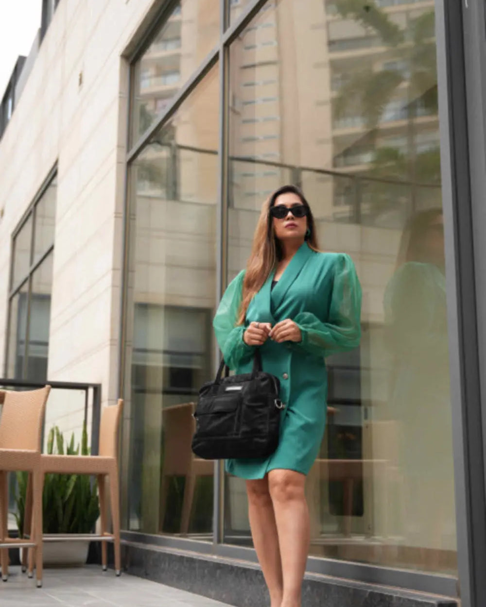 Women's green single-breasted blazer dress for minimalist styling.