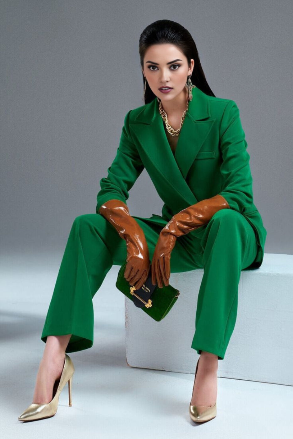 green plaid blazer suit set with padded shoulders and pleated pants.