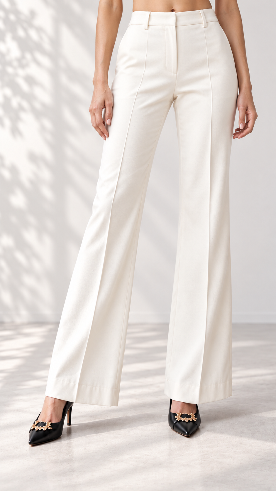 Ivory flared suit trousers with belt loops and centre crease, close-up | Beyond Formals