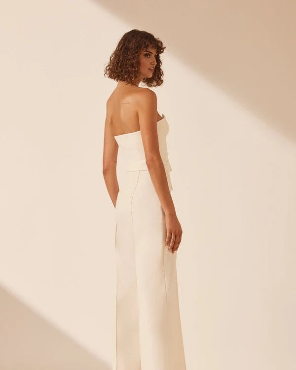 White strapless bustier with structured panels for formal layering.