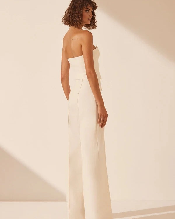 White strapless bustier with structured panels for formal layering.