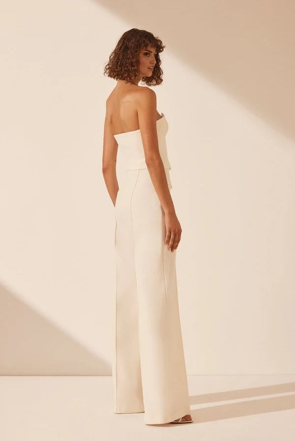 White strapless bustier with structured panels for formal layering.