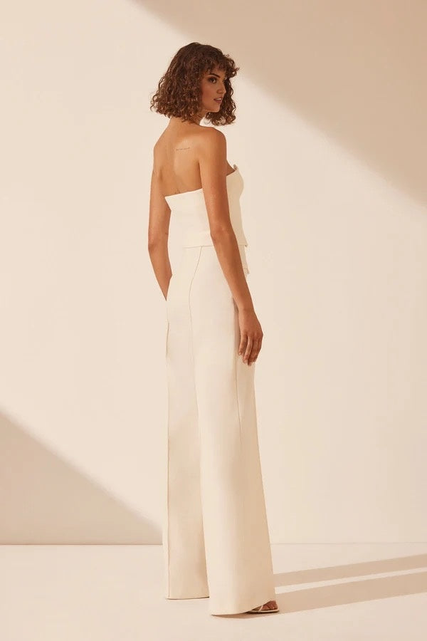 White strapless bustier with structured panels for formal layering.