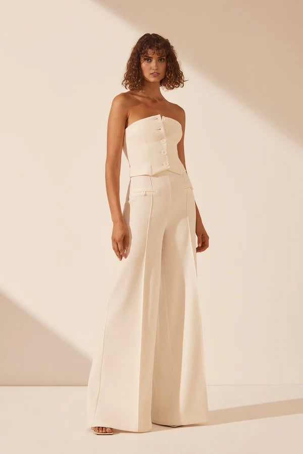 White strapless bustier with structured panels for formal layering.