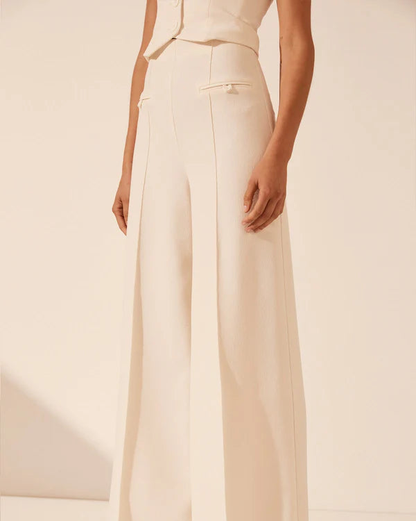 White strapless bustier with structured panels for formal layering.