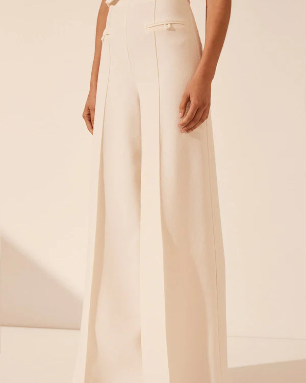 White strapless bustier with structured panels for formal layering.