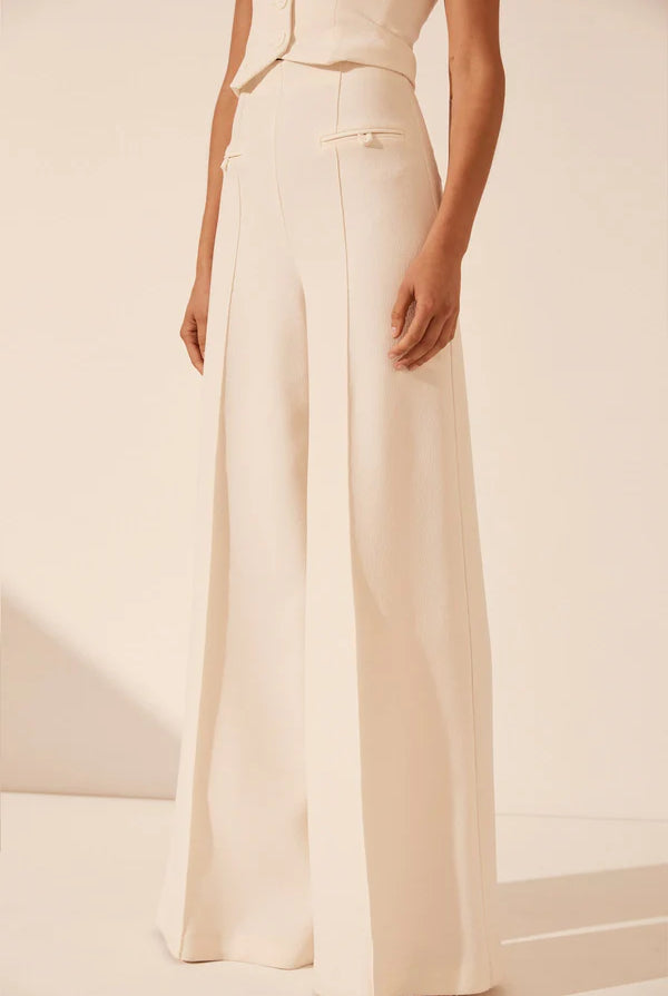White strapless bustier with structured panels for formal layering.