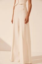 White strapless bustier with structured panels for formal layering.
