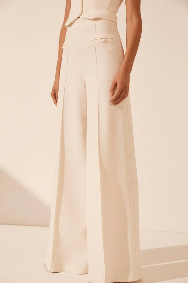 White strapless bustier with structured panels for formal layering.