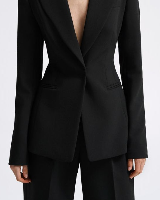 Women's black tailored blazer suit set with straight-fit trousers for office wear.