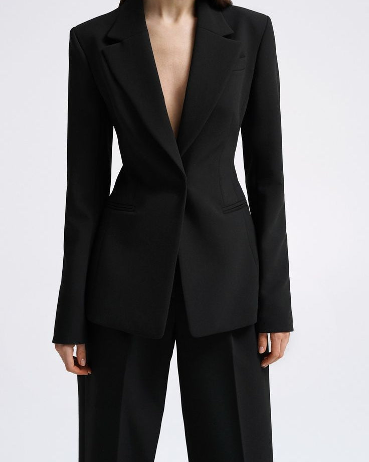 Women's black tailored blazer suit set with straight-fit trousers for office wear.