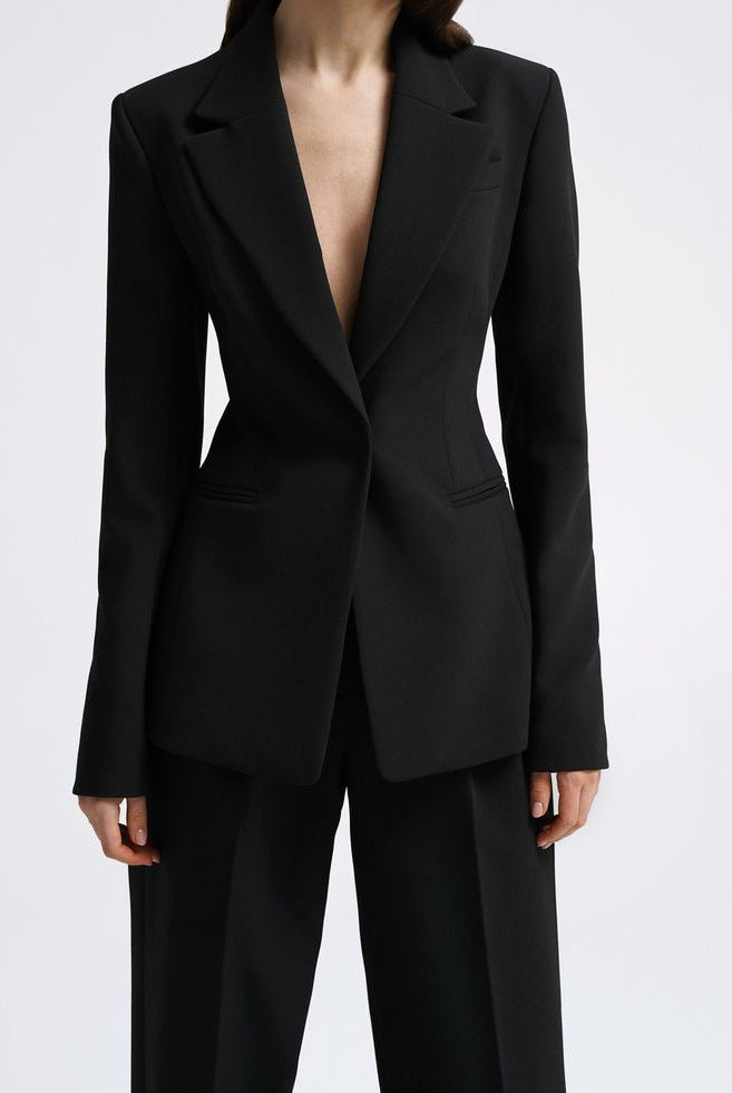Women's black tailored blazer suit set with straight-fit trousers for office wear.
