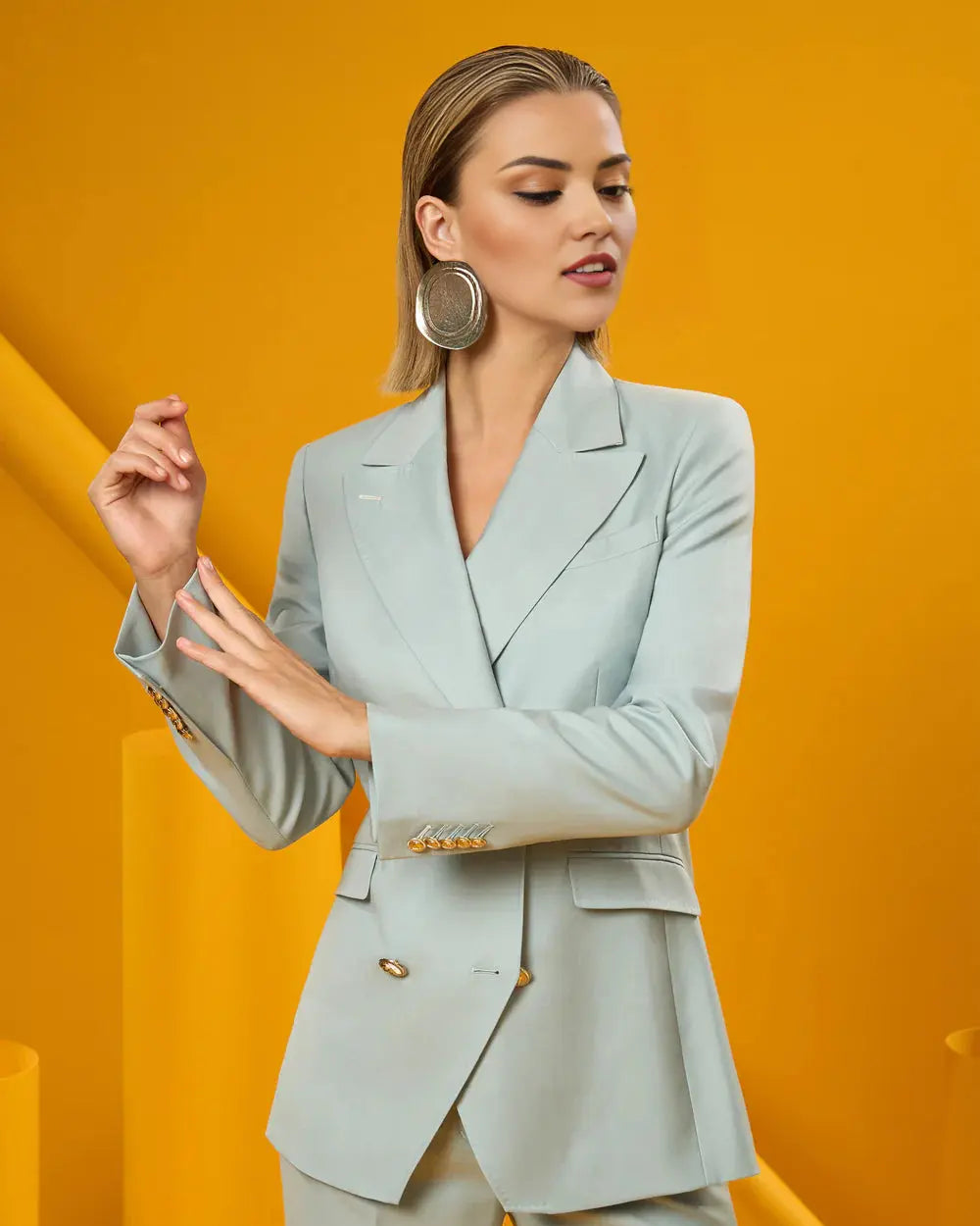 Women's mint blazer suit set with a modern tailored fit.