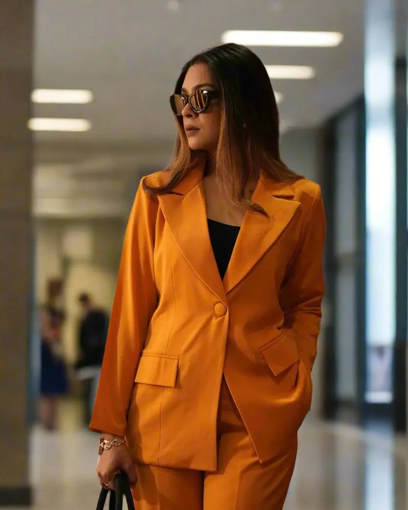 Women's mustard blazer suit set with cotton lapels and tailored pants.