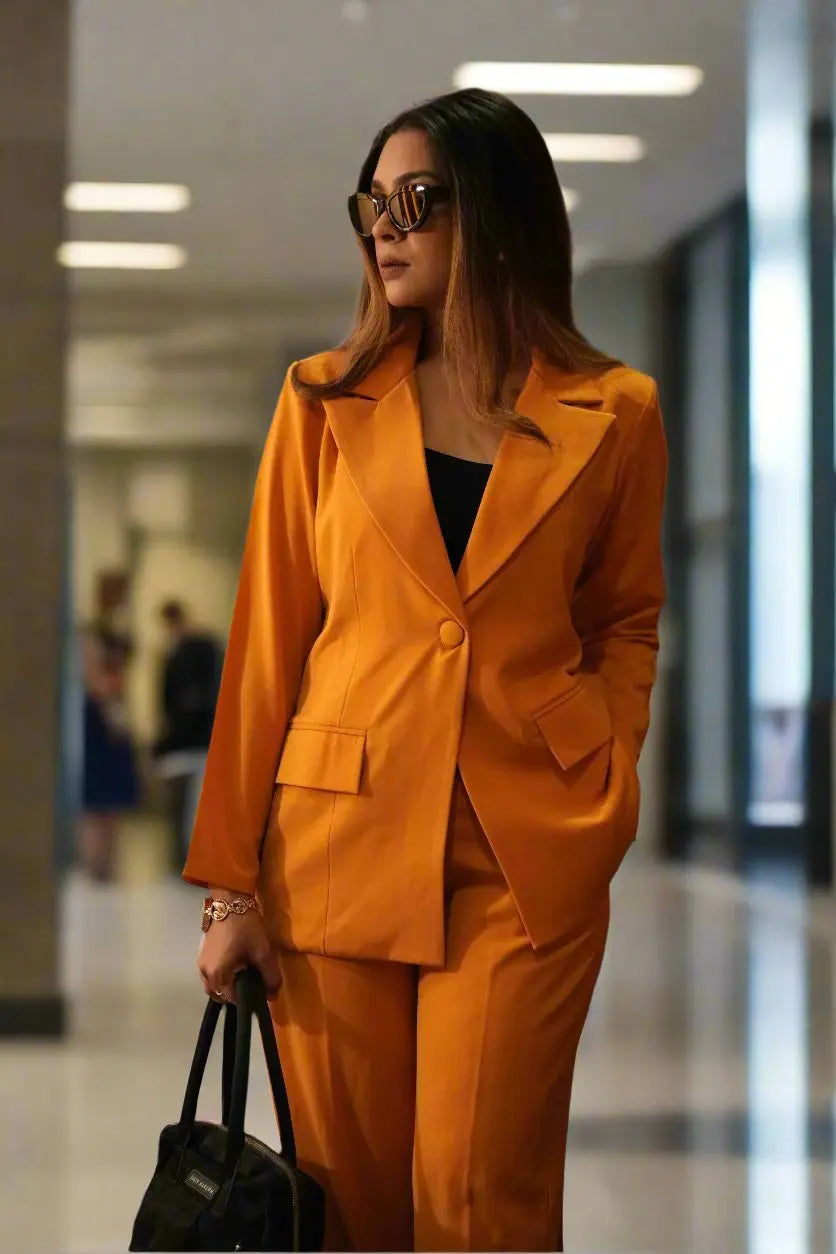 Women's mustard blazer suit set with cotton lapels and tailored pants.