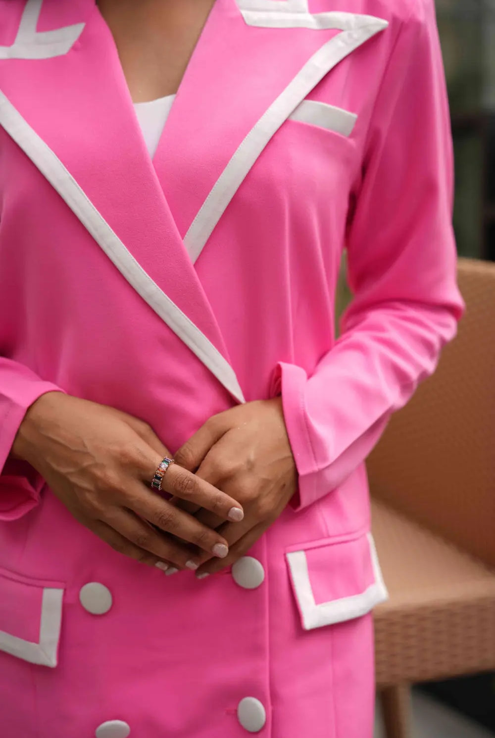 Women's pink blazer dress with a high neckline for evening formals.